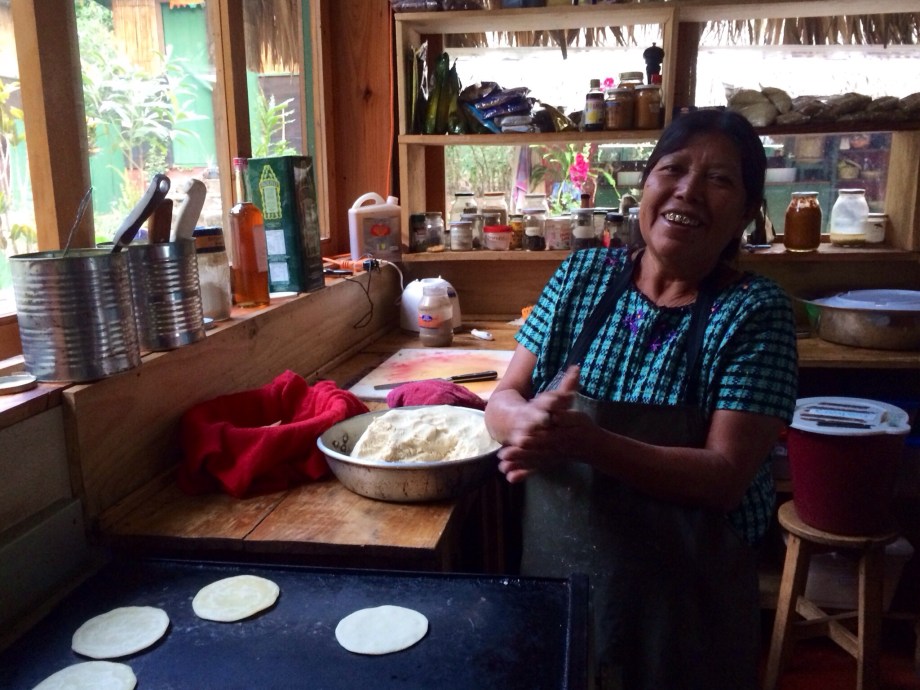 Natalia, the house mama, making tortillas. Natalia is a loveable Mayan woman from the nearest town. She doesn't speak any English, but we get along great with facial expressions and laughter.